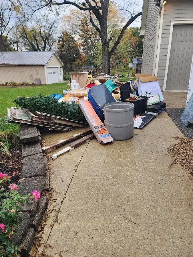 Dumpster being loaded with debris for Commercial Dumpster Rental in Coxsackie